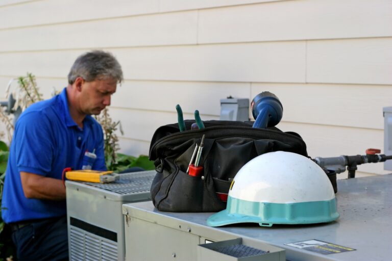 tech repairing ac outside
