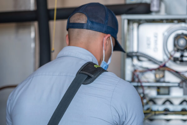 Tech working on ac unit